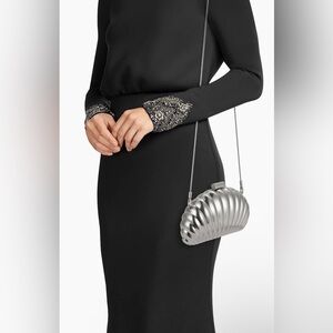 SIMKHAI Monet shell clutch bag in a silver-tone aluminum finish